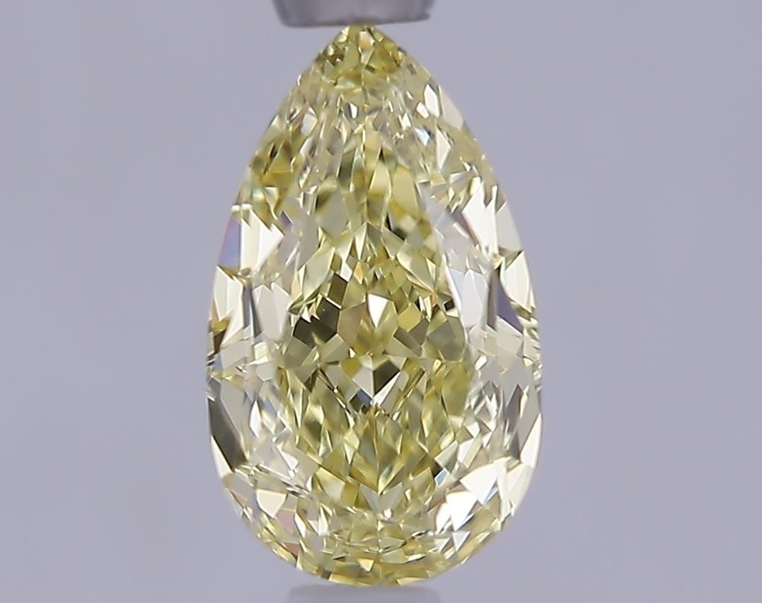Loose Lab Diamond - IGI Pear 1.05ct Fancy Yellow VVS2: Loose Lab Diamond - IGI Pear 1.05ct Fancy Yellow VVS2 Experience the beauty of nature's own sunshine with this exquisite 1.05ct Fancy Yellow Lab Diamond, certified by the International Gemological Ins