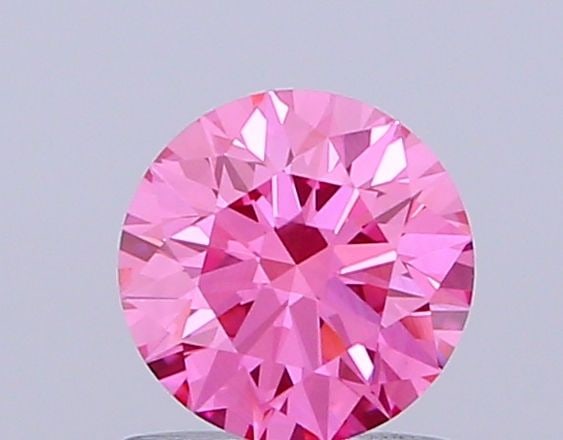 IGI Round 0.71ct Fancy Vivid Pink VVS2 Ideal Loose Lab Diamond: IGI Round 0.71ct Fancy Vivid Pink VVS2 Ideal Loose Lab Diamond Experience the rare beauty of a Fancy Vivid Pink diamond, one of the most coveted colors in the world of gemstones. This exquisite 0.71ct