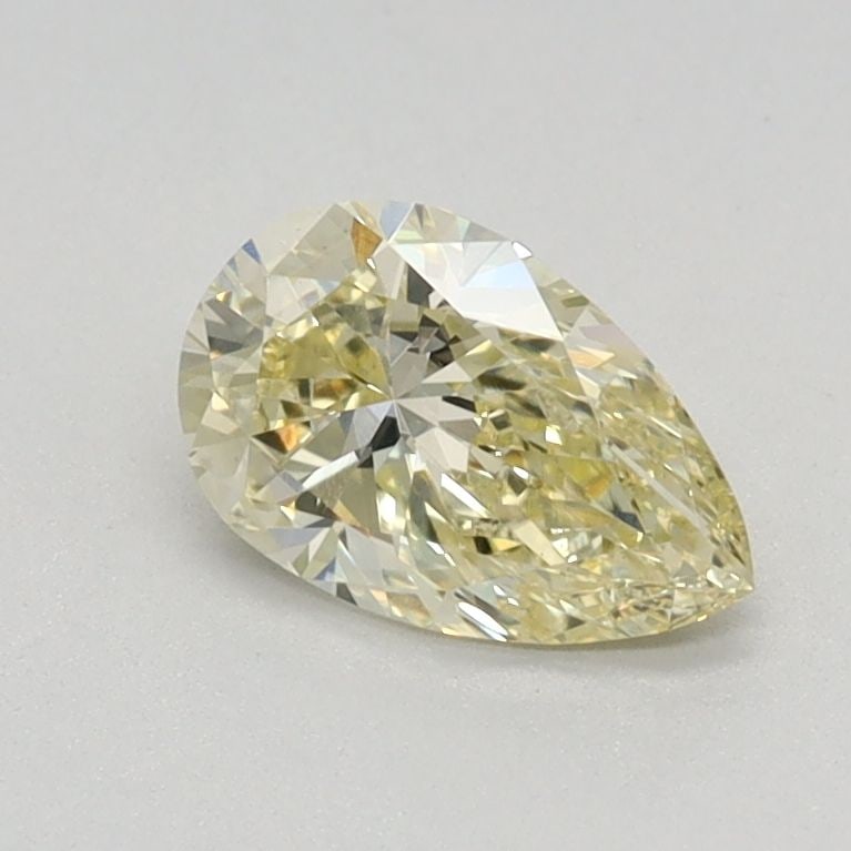 Loose Lab Diamond - IGI Pear 0.58ct Fancy Light Yellow VVS2: Loose Lab Diamond - IGI Pear 0.58ct Fancy Light Yellow VVS2 A rare and vibrant Fancy Light Yellow lab diamond, certified by the International Gemological Institute (IGI), boasts exceptional clarity wi