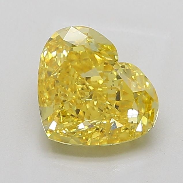 IGI Heart 3.0ct Fancy Vivid Yellow VVS2 Loose Lab Diamond: IGI Heart 3.0ct Fancy Vivid Yellow VVS2 Loose Lab Diamond Experience the brilliance of nature in a lab-grown diamond, certified by IGI as a Fancy Vivid Yellow VVS2, 3.0ct loose gemstone. Its EX polish