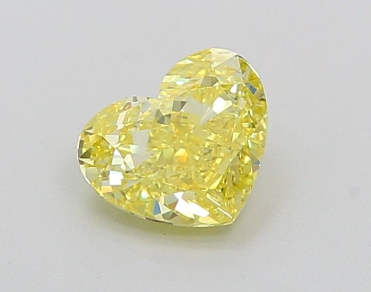 Loose Lab Diamond - IGI Heart 1.01ct Fancy Vivid Yellow VVS1: Loose Lab Diamond - IGI Heart 1.01ct Fancy Vivid Yellow VVS1 Experience the brilliance of nature in a lab-grown diamond, certified by IGI as a Fancy Vivid Yellow VVS1. This exceptional 1.01ct stone bo