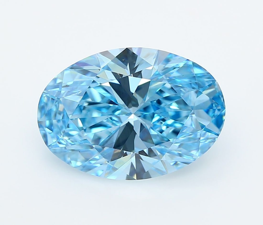 IGI Oval 5.02ct Fancy Vivid Blue VVS2 Diamond: IGI Oval 5.02ct Fancy Vivid Blue VVS2 Diamond Experience the breathtaking beauty of nature in this stunning 5.02ct Fancy Vivid Blue VVS2 diamond, certified by the International Gemological Institute (