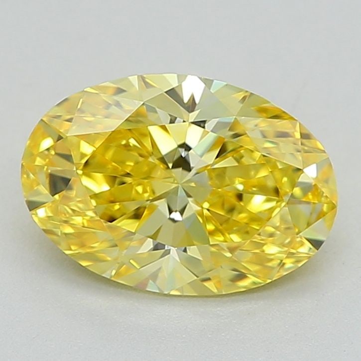 IGI Oval 0.82ct Fancy Vivid Yellow VVS2 Diamond: IGI Oval 0.82ct Fancy Vivid Yellow VVS2 Diamond Experience the vibrant beauty of nature in this stunning 0.82ct Fancy Vivid Yellow VVS2 diamond, certified by the International Gemological Institute (I