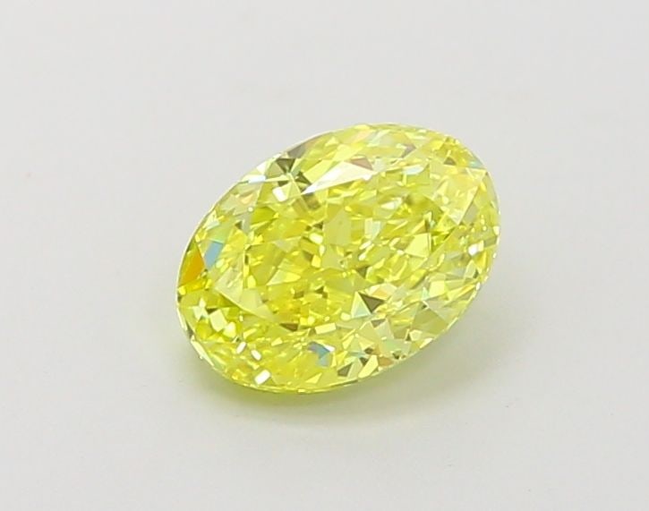 IGI Oval 1.01ct Fancy Vivid Yellow VVS2 Loose Lab Diamond: IGI Oval 1.01ct Fancy Vivid Yellow VVS2 Loose Lab Diamond A rare and radiant gem, this 1.01ct Fancy Vivid Yellow VVS2 lab diamond shines with exceptional clarity and polish, boasting an EX symmetry