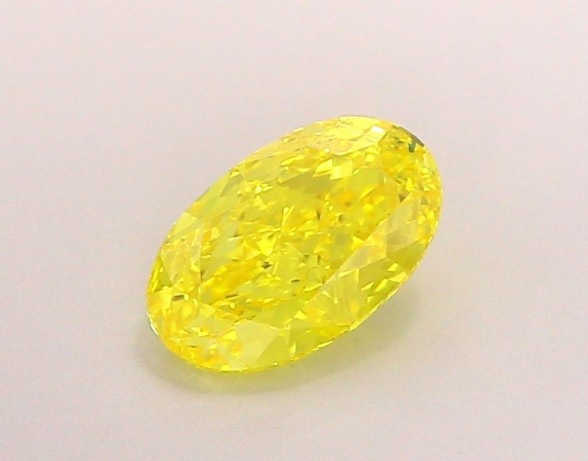 IGI Oval 1.05ct Fancy Vivid Yellow VVS2 Loose Lab Diamond: IGI Oval 1.05ct Fancy Vivid Yellow VVS2 Loose Lab Diamond Experience the vibrant beauty of nature in this exquisite 1.05ct Fancy Vivid Yellow VVS2 lab-grown diamond, certified by the International Gem