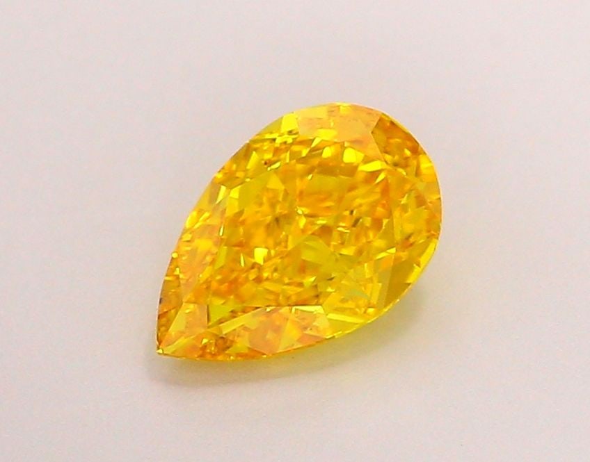 Loose Lab Diamond - IGI Pear 1.06ct Fancy Vivid Orangey Yellow VVS2: Loose Lab Diamond - IGI Pear 1.06ct Fancy Vivid Orangey Yellow VVS2 Experience the vibrant beauty of nature in this stunning lab-grown diamond, certified by IGI as Fancy Vivid Orangey Yellow, boasting
