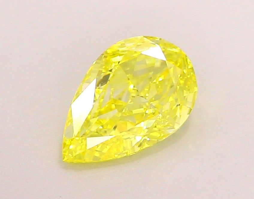 Loose Lab Diamond - IGI Pear 1.28ct Fancy Vivid Yellow VVS2: Loose Lab Diamond - IGI Pear 1.28ct Fancy Vivid Yellow VVS2 Experience the brilliance of nature's own sunshine in this stunning 1.28ct Fancy Vivid Yellow lab diamond, certified by IGI and boasting exc