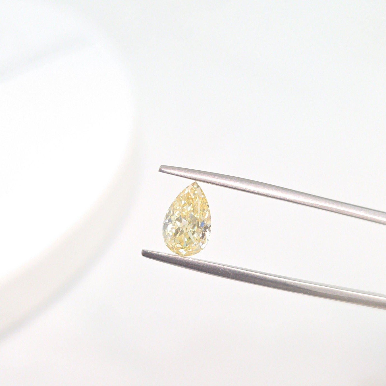 Loose Lab Diamond - IGI Pear 1.51ct Fancy Yellow VVS2: Loose Lab Diamond - IGI Pear 1.51ct Fancy Yellow VVS2 A stunning Fancy Yellow lab diamond, certified by the International Gemological Institute (IGI), boasts exceptional clarity and color, with a vibr
