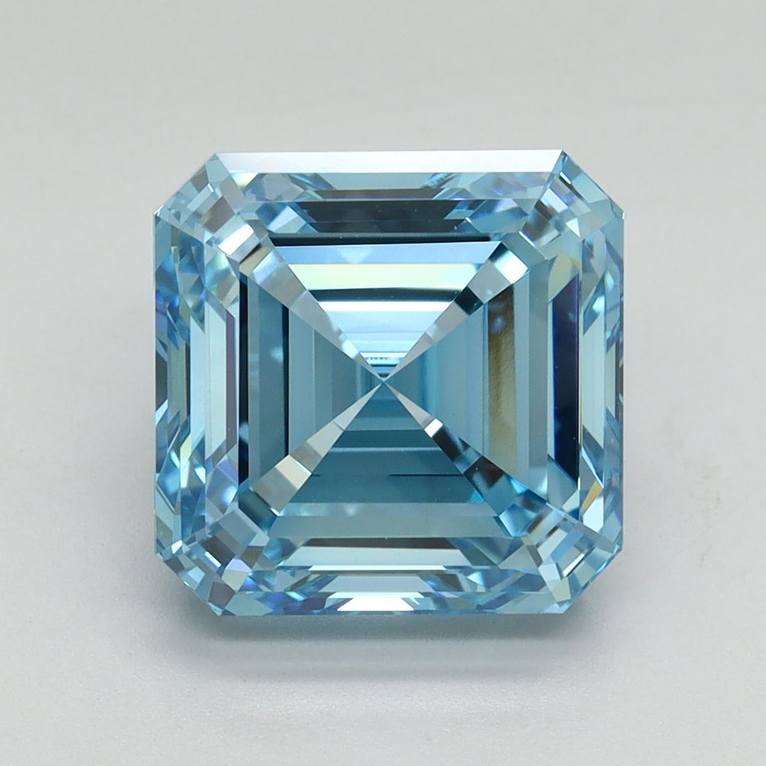 IGI Asscher 5.02ct Fancy Vivid Blue VVS2 Loose Lab Diamond: IGI Asscher 5.02ct Fancy Vivid Blue VVS2 Loose Lab Diamond Experience the unparalleled beauty of nature in this exquisite 5.02ct Fancy Vivid Blue VVS2 lab-grown diamond, certified by the International