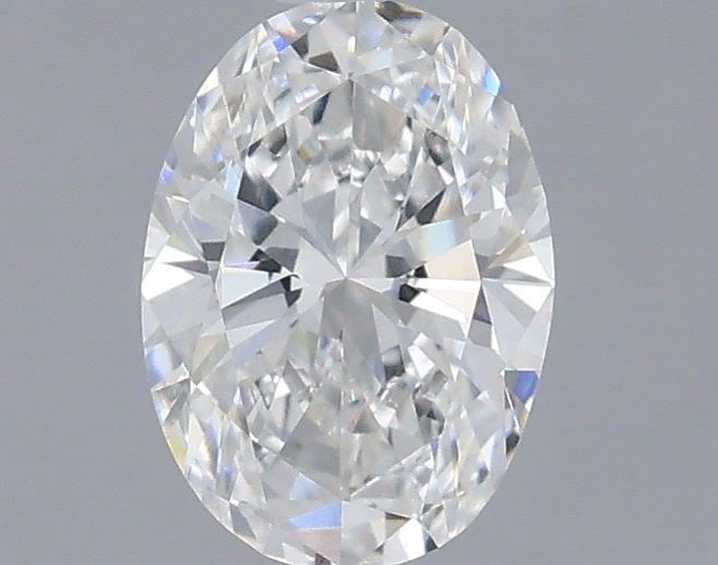 IGI Oval 0.54ct E VVS2 Loose Lab Diamond: IGI Oval 0.54ct E VVS2 Loose Lab Diamond A stunning lab-grown diamond, certified by the International Gemological Institute (IGI), boasts exceptional clarity with a VVS2 grade and vibrant color of E.