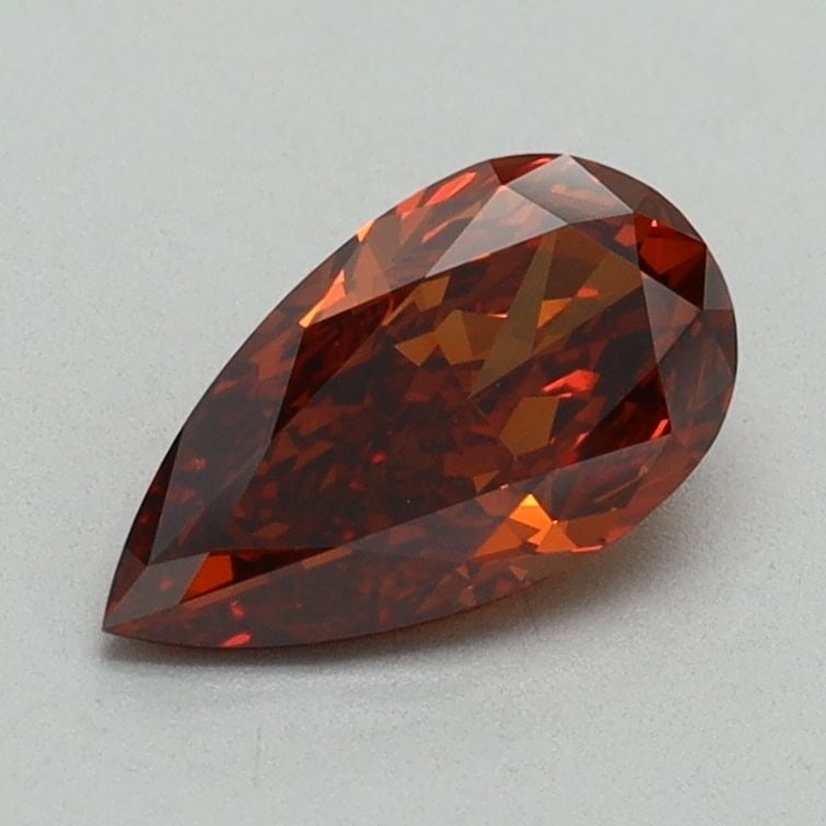 Loose Lab Diamond - IGI Pear 0.93ct Fancy Orange VVS2: Loose Lab Diamond - IGI Pear 0.93ct Fancy Orange VVS2 Experience the vibrant beauty of a Fancy Orange lab diamond, certified by the International Gemological Institute (IGI) as VVS2 clarity and GD pol