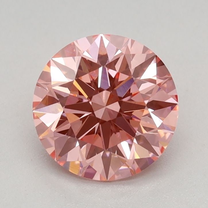 IGI Round 0.83ct Fancy Vivid Pink VVS2 Loose Lab Diamond: IGI Round 0.83ct Fancy Vivid Pink VVS2 Loose Lab Diamond Experience the beauty of a lab-grown diamond, certified by the International Gemological Institute (IGI) as Fancy Vivid Pink, VVS2, and EX cut.