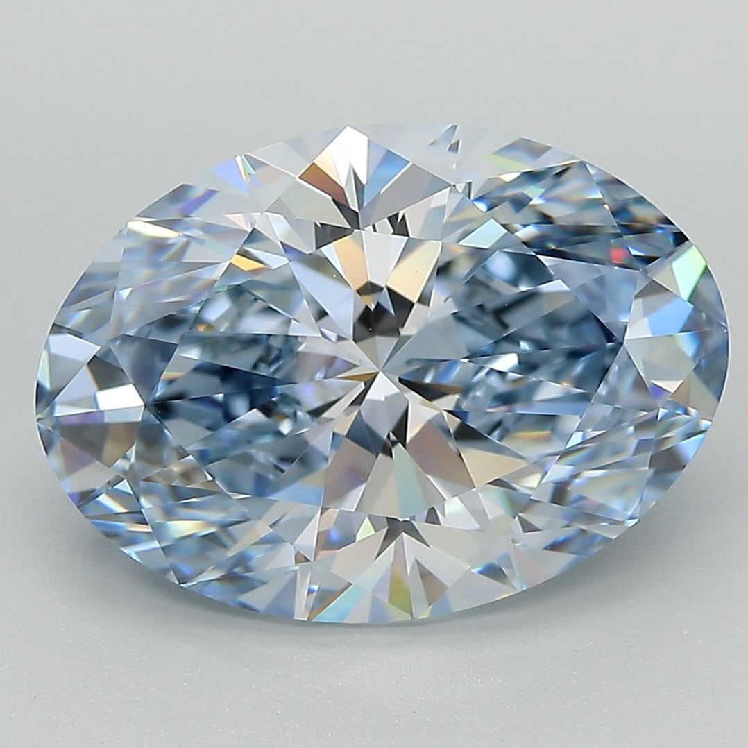 IGI Oval 5.11ct Fancy Vivid Blue VVS2 Lab Diamond: IGI Oval 5.11ct Fancy Vivid Blue VVS2 Lab Diamond Experience the breathtaking beauty of a Fancy Vivid Blue lab diamond, certified by the International Gemological Institute (IGI). This stunning 5.11ct