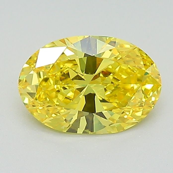 IGI Oval 0.94ct Fancy Vivid Yellow VVS1 Loose Lab Diamond: IGI Oval 0.94ct Fancy Vivid Yellow VVS1 Loose Lab Diamond A stunning Fancy Vivid Yellow diamond, certified by the International Gemological Institute (IGI), boasts exceptional clarity and color. This