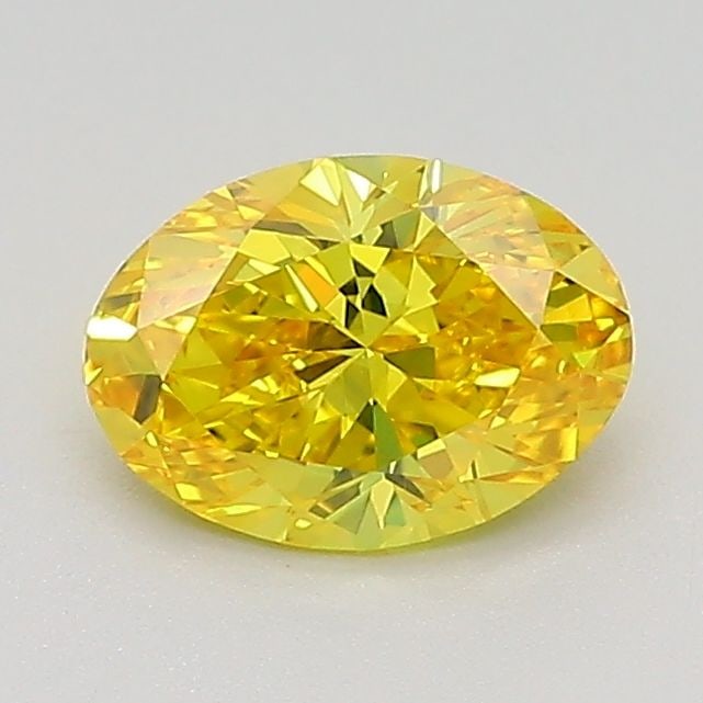 IGI Oval 0.73ct Fancy Vivid Yellow VVS2 Loose Lab Diamond: IGI Oval 0.73ct Fancy Vivid Yellow VVS2 Loose Lab Diamond Experience the beauty of nature with this stunning 0.73ct Fancy Vivid Yellow VVS2 lab-grown diamond, certified by the International Gemologica
