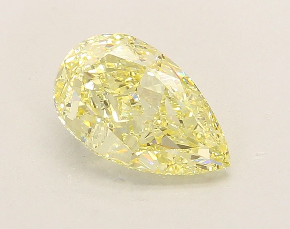 Loose Lab Diamond - IGI Pear 2.7ct Fancy Yellow VVS2: Loose Lab Diamond - IGI Pear 2.7ct Fancy Yellow VVS2 A rare and radiant gem, this 2.7ct Fancy Yellow Lab Diamond boasts exceptional clarity (VVS2) and polish (EX), giving it a truly luxurious appearan