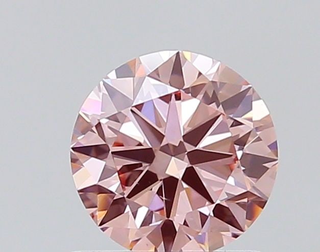 Loose Lab Diamond - Round 0.76ct Fancy Vivid Pink VVS2: Loose Lab Diamond - Round 0.76ct Fancy Vivid Pink VVS2 Experience the rare beauty of a Fancy Vivid Pink diamond, one of the most coveted colors in the world of gemstones. This exquisite 0.76ct lab-gro