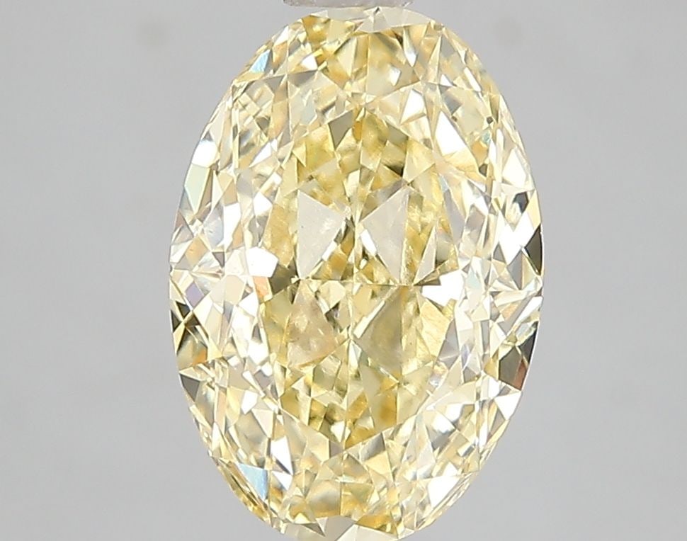 IGI Oval 3.02ct Fancy Intense Yellow VVS2 Loose Lab Diamond: IGI Oval 3.02ct Fancy Intense Yellow VVS2 Loose Lab Diamond Experience the warmth and brightness of a rare Fancy Intense Yellow diamond, certified by the International Gemological Institute (IGI) as V