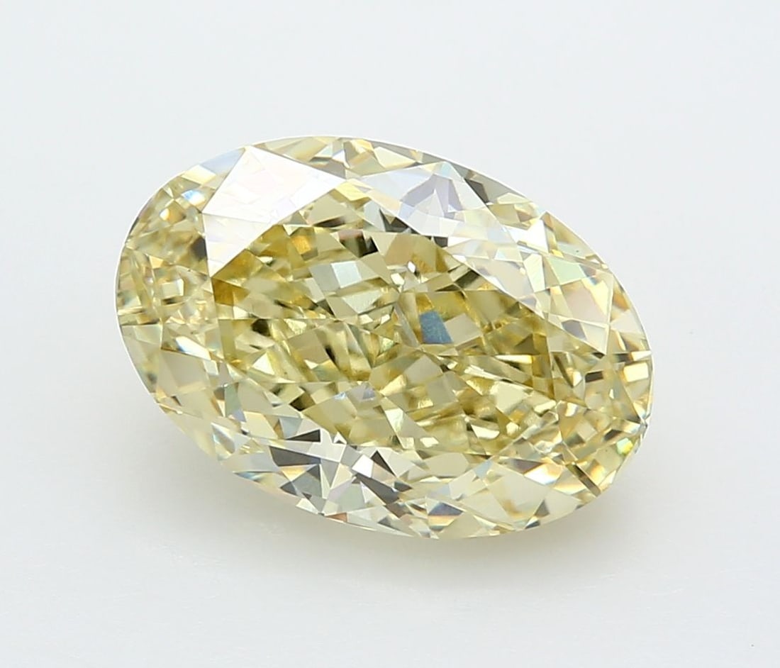 IGI Oval 7.07ct Fancy Yellow VVS2 Loose Lab Diamond: IGI Oval 7.07ct Fancy Yellow VVS2 Loose Lab Diamond Experience the warmth and elegance of nature with this stunning 7.07ct Fancy Yellow VVS2 loose lab diamond, certified by IGI and boasting exceptiona