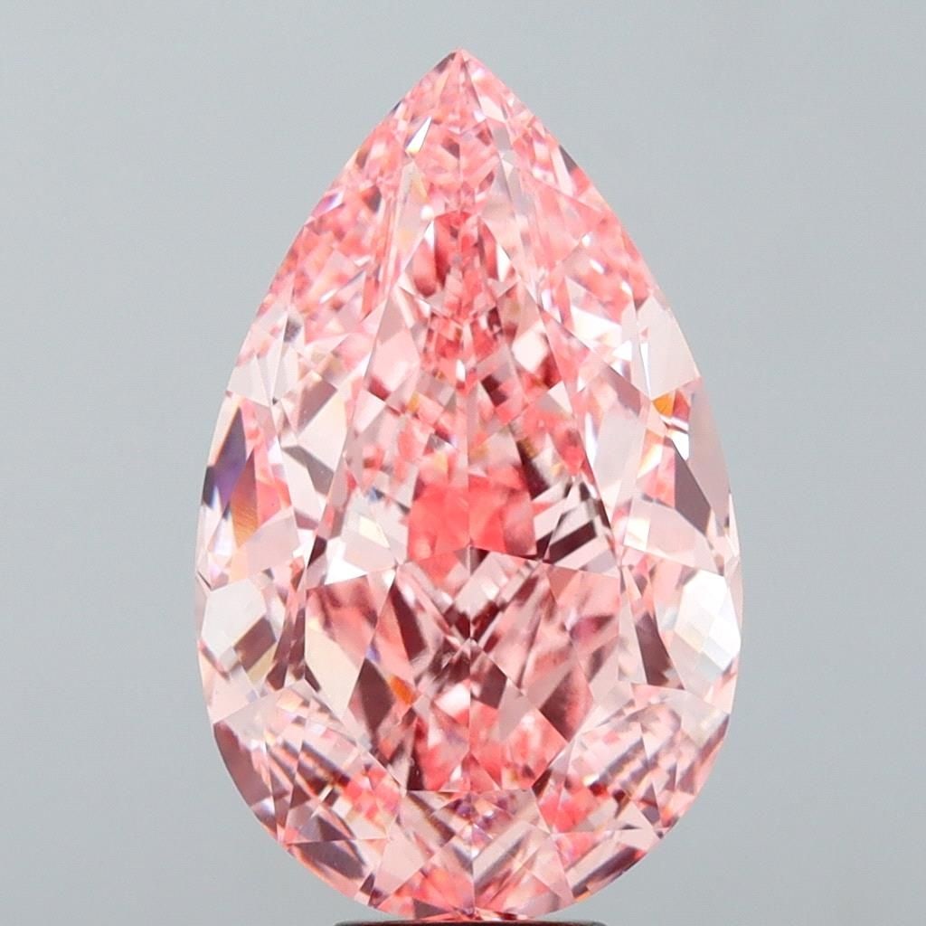 Loose Lab Diamond - IGI Pear 15.04ct Fancy Vivid Pink VVS2: Loose Lab Diamond - IGI Pear 15.04ct Fancy Vivid Pink VVS2 Experience the rare beauty of a lab-grown diamond, certified by the International Gemological Institute (IGI) as Fancy Vivid Pink, with excep