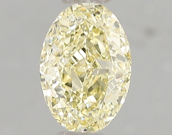 IGI Oval 1.03ct Fancy Intense Yellow VVS2 Loose Lab Diamond: IGI Oval 1.03ct Fancy Intense Yellow VVS2 Loose Lab Diamond Experience the warmth of a sunny day in the palm of your hand with this exquisite 1.03ct Fancy Intense Yellow VVS2 lab-grown diamond, boasti