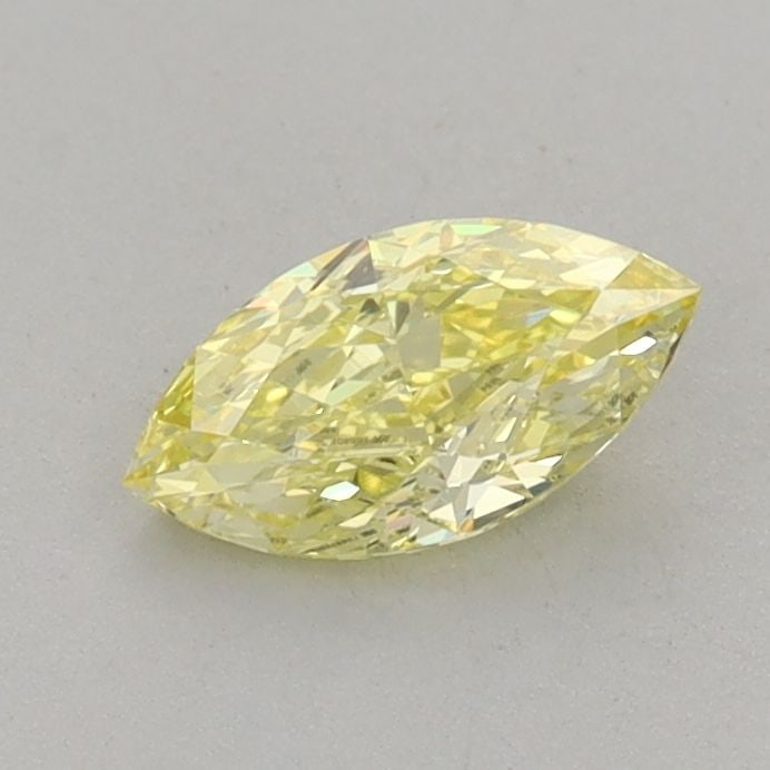 IGI Marquise 0.52ct Fancy Vivid Yellow VVS2 Loose Lab Diamond: IGI Marquise 0.52ct Fancy Vivid Yellow VVS2 Loose Lab Diamond Experience the vibrant beauty of nature with this stunning Fancy Vivid Yellow lab-grown diamond, boasting a mesmerizing 0.52ct carat weigh