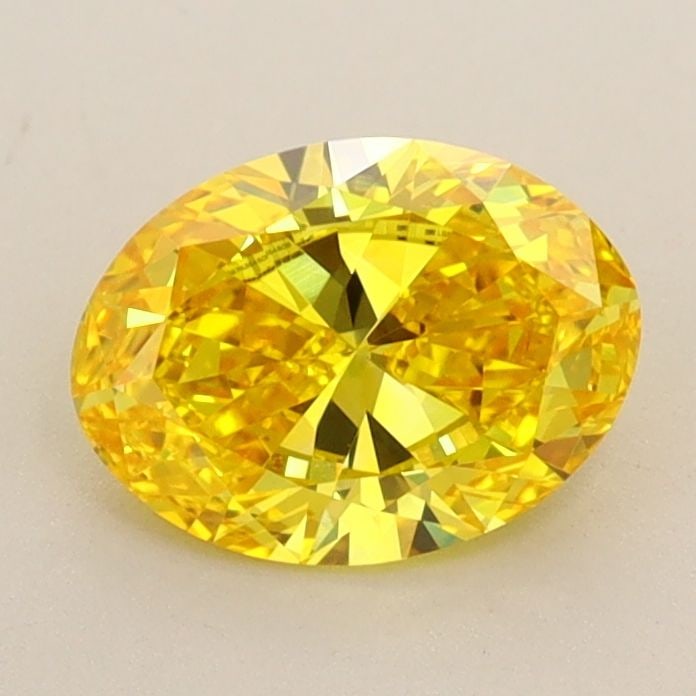 IGI Oval 1.03ct Fancy Vivid Yellow VVS2 Loose Lab Diamond: IGI Oval 1.03ct Fancy Vivid Yellow VVS2 Loose Lab Diamond A stunning Fancy Vivid Yellow lab diamond, certified by the International Gemological Institute (IGI), boasts exceptional color and clarity. M
