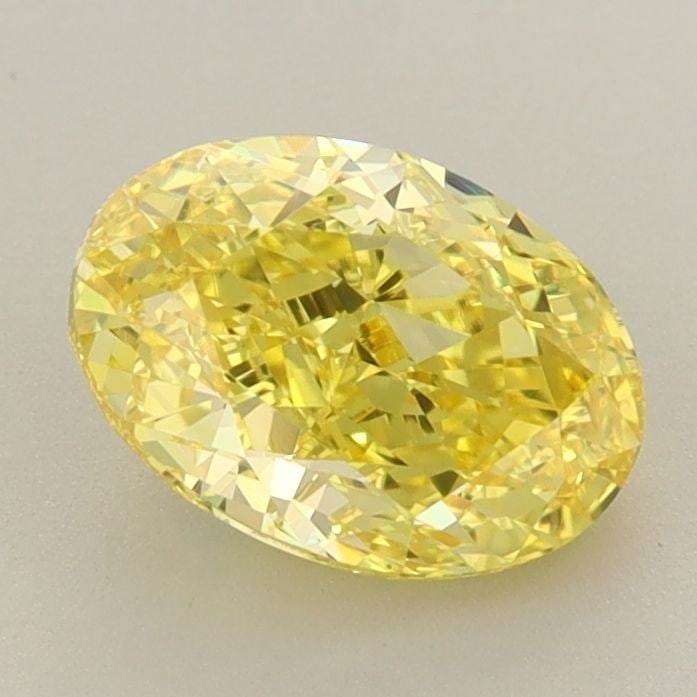 IGI Oval 1.7ct Fancy Vivid Yellow VVS2 Loose Lab Diamond: IGI Oval 1.7ct Fancy Vivid Yellow VVS2 Loose Lab Diamond Experience the vibrant beauty of nature in this stunning 1.7ct Fancy Vivid Yellow VVS2 lab-grown diamond, certified by the International Gemolo
