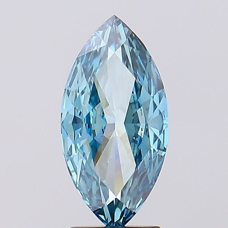 IGI Marquise 3.14ct Fancy Vivid Blue VVS2 Loose Lab Diamond: IGI Marquise 3.14ct Fancy Vivid Blue VVS2 Loose Lab Diamond Experience the rare beauty of a Fancy Vivid Blue lab-grown diamond, boasting exceptional clarity (VVS2) and cut quality (EX), with an impres