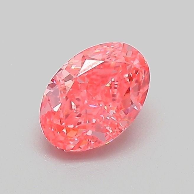 IGI Oval 0.61ct Fancy Vivid Pink VVS2 Diamond: IGI Oval 0.61ct Fancy Vivid Pink VVS2 Diamond Experience the rare beauty of a Fancy Vivid Pink diamond, one of the most coveted colors in the world of gemstones. This exceptional 0.61ct lab-grown IGI-