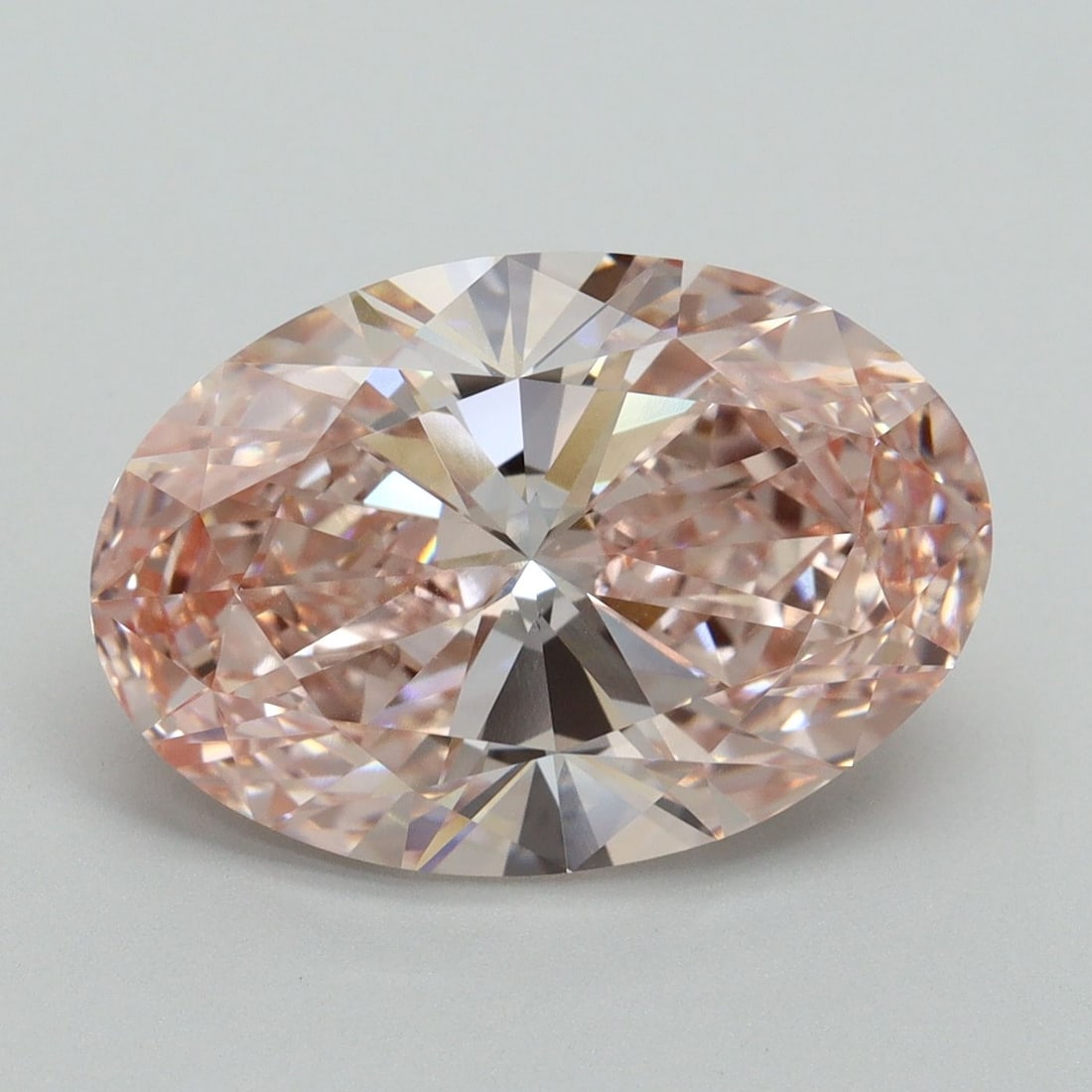 IGI Oval 6.5ct Fancy Vivid Pink VVS2 Loose Lab Diamond: IGI Oval 6.5ct Fancy Vivid Pink VVS2 Loose Lab Diamond Experience the rare beauty of a Fancy Vivid Pink diamond, one of the most coveted colors in the world of gemstones. This stunning 6.5ct lab-grown