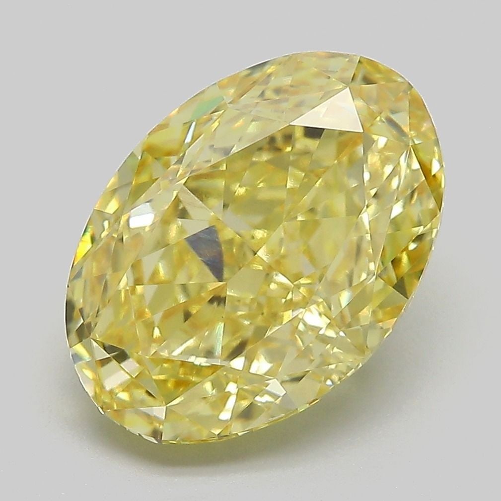 IGI Oval 5.08ct Fancy Vivid Yellow VVS2 Loose Lab Diamond: IGI Oval 5.08ct Fancy Vivid Yellow VVS2 Loose Lab Diamond Experience the vibrant warmth of a genuine lab-grown Fancy Vivid Yellow diamond, boasting exceptional clarity and cut quality with its VVS2 ce