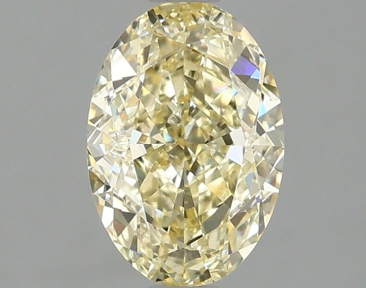 IGI Oval 1.59ct Fancy Yellow VVS2 Loose Lab Diamond: IGI Oval 1.59ct Fancy Yellow VVS2 Loose Lab Diamond Experience the beauty of nature in a lab-grown wonder, this 1.59ct Fancy Yellow VVS2 diamond boasts exceptional clarity and cut, with an EX polish a