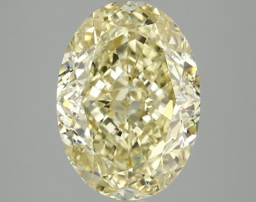 IGI Oval 4.07ct Fancy Intense Yellow VVS2 Loose Lab Diamond: IGI Oval 4.07ct Fancy Intense Yellow VVS2 Loose Lab Diamond Experience the vibrant warmth of a genuine lab-grown Fancy Intense Yellow diamond, boasting an impressive 4.07ct cut and exceptional clarity