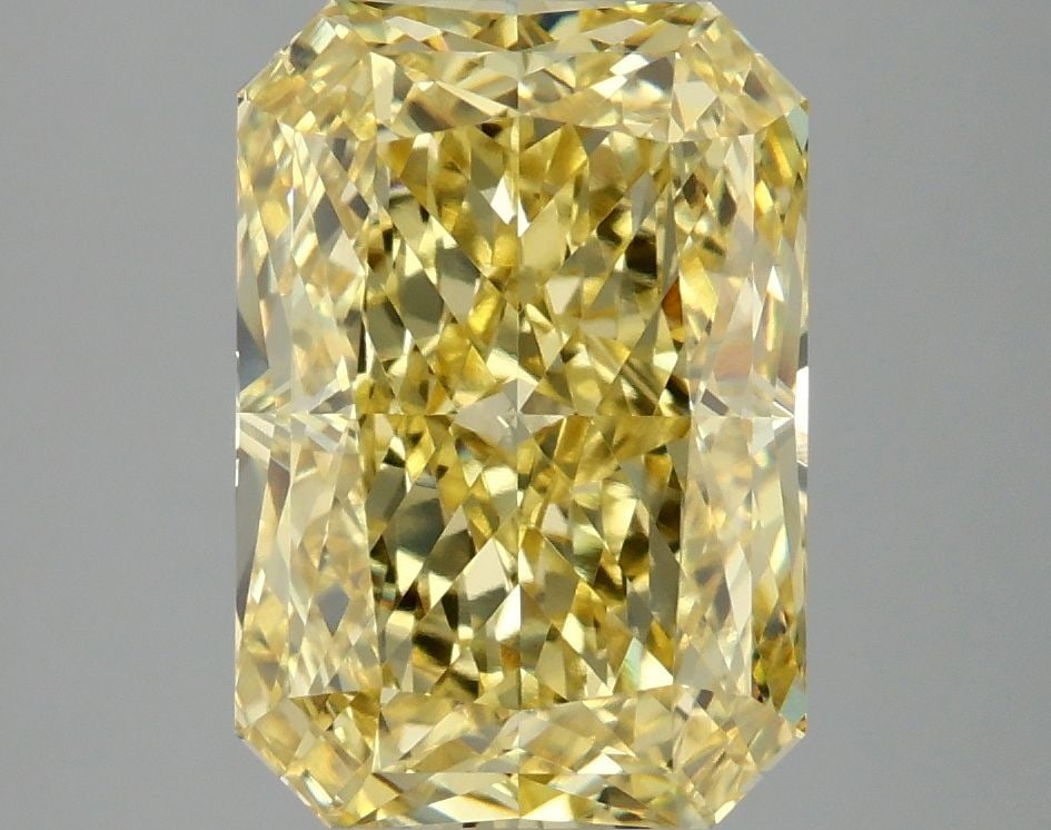 IGI Radiant 4.1ct Fancy Vivid Yellow VVS2 Loose Lab Diamond: IGI Radiant 4.1ct Fancy Vivid Yellow VVS2 Loose Lab Diamond Experience the vibrant beauty of nature in this stunning 4.1ct Fancy Vivid Yellow VVS2 loose lab diamond, certified by the International Gem
