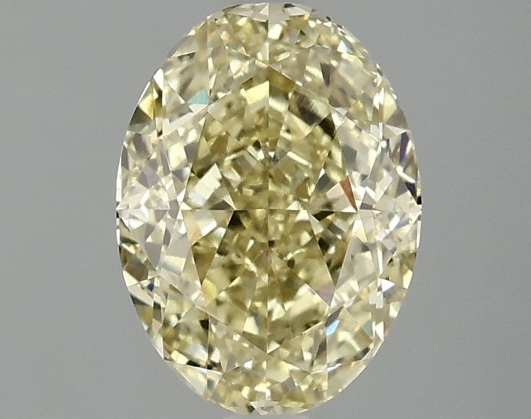 IGI Oval 2.09ct Fancy Vivid Yellow VVS2 Loose Lab Diamond: IGI Oval 2.09ct Fancy Vivid Yellow VVS2 Loose Lab Diamond Experience the brilliance of nature, reimagined in a lab-grown diamond that rivals its mined counterparts. This stunning 2.09ct Fancy Vivid Ye