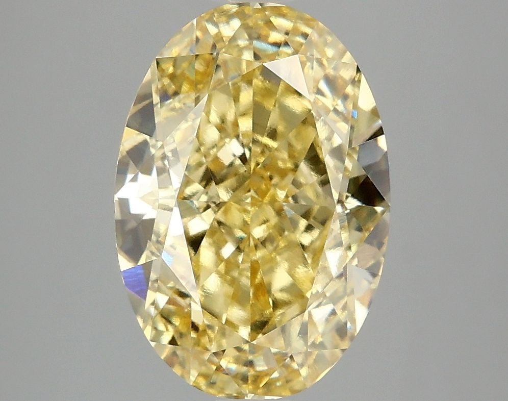 IGI Oval 4.1ct Fancy Vivid Yellow VVS2 Loose Lab Diamond: IGI Oval 4.1ct Fancy Vivid Yellow VVS2 Loose Lab Diamond Experience the vibrant beauty of nature in this stunning 4.1ct Fancy Vivid Yellow VVS2 lab-grown diamond, certified by IGI and boasting excepti
