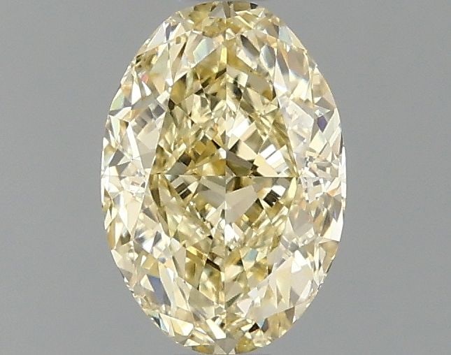 IGI Oval 1.1ct Fancy Yellow VVS2 Loose Lab Diamond: IGI Oval 1.1ct Fancy Yellow VVS2 Loose Lab Diamond A rare and radiant Fancy Yellow diamond, certified by the International Gemological Institute (IGI), boasts exceptional clarity with a VVS2 grade and