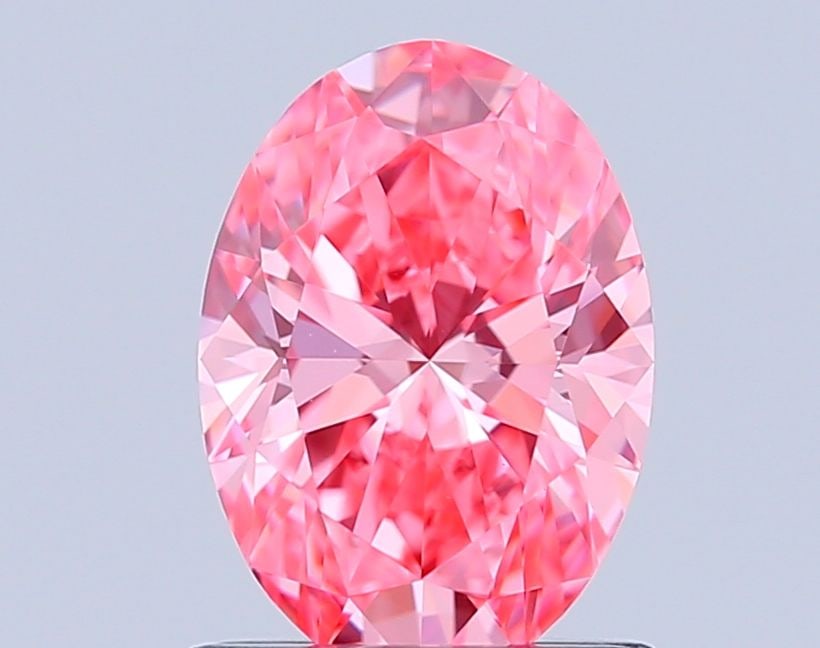 IGI Oval 1.03ct Fancy Vivid Pink VVS2 Loose Lab Diamond: IGI Oval 1.03ct Fancy Vivid Pink VVS2 Loose Lab Diamond Experience the unparalleled beauty of a lab-grown Fancy Vivid Pink diamond, certified by the International Gemological Institute (IGI) as VVS2 c