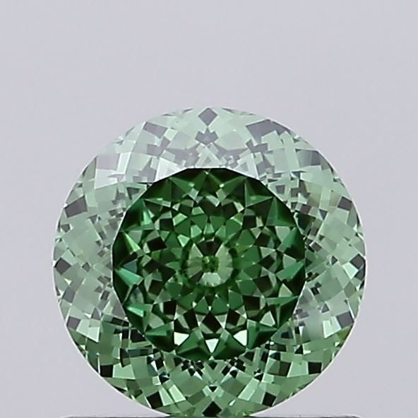 IGI Round 0.7ct Fancy Vivid Green VVS2 Loose Lab Diamond: IGI Round 0.7ct Fancy Vivid Green VVS2 Loose Lab Diamond A true gem for the discerning collector, this 0.7ct Fancy Vivid Green lab diamond boasts exceptional clarity and color, with a VVS2 grade that