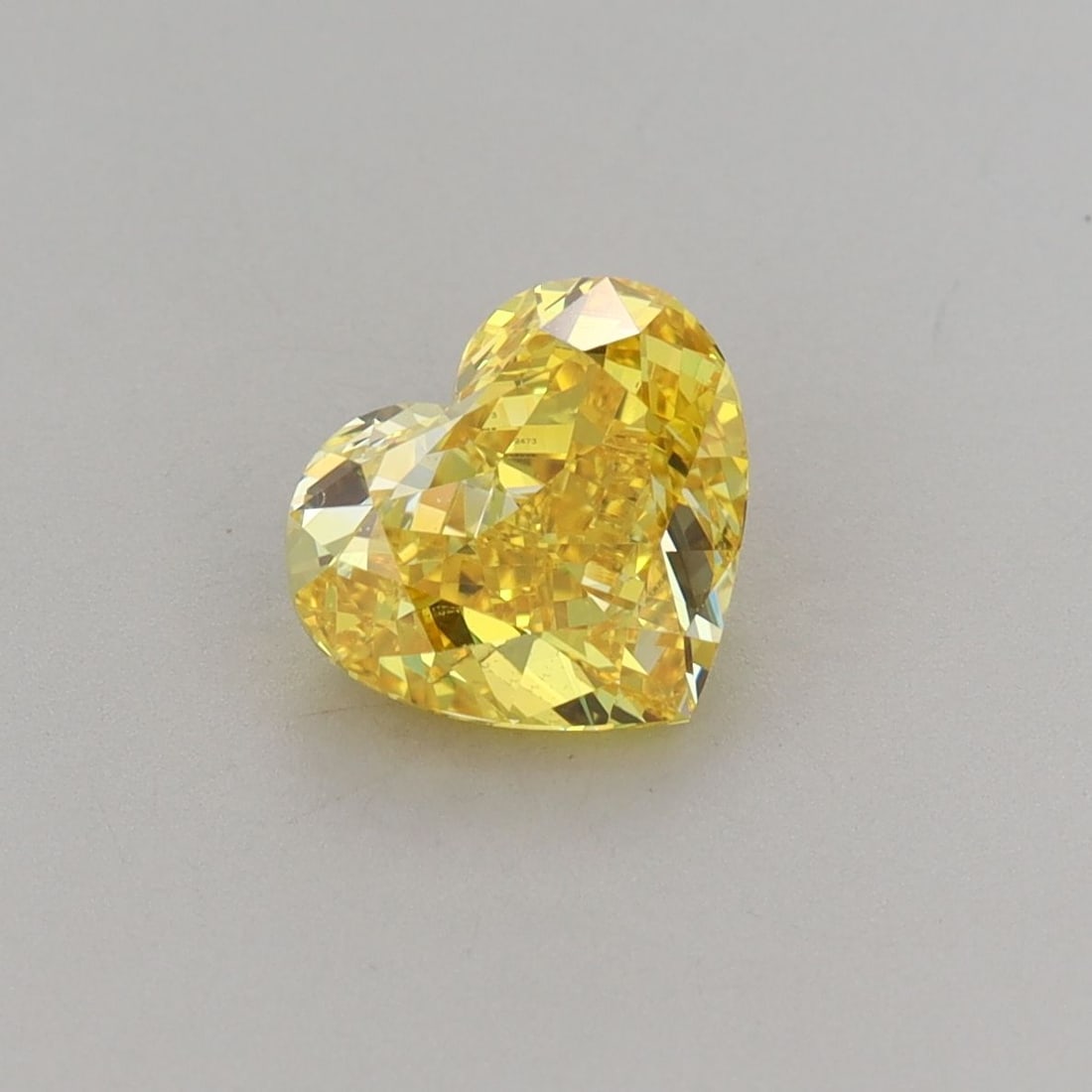 Loose Lab Diamond - IGI Heart 1.42ct Fancy Vivid Yellow VVS2: Loose Lab Diamond - IGI Heart 1.42ct Fancy Vivid Yellow VVS2 Experience the brilliance of nature's own sunshine with this stunning 1.42ct Fancy Vivid Yellow lab diamond, certified by the International