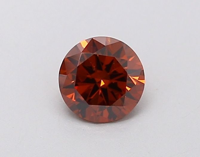 IGI Round 0.7ct Fancy Deep Orange VVS2 Loose Lab Diamond: IGI Round 0.7ct Fancy Deep Orange VVS2 Loose Lab Diamond Experience the vibrant beauty of nature with this stunning 0.7ct Fancy Deep Orange VVS2 loose lab diamond, certified by the International Gemol