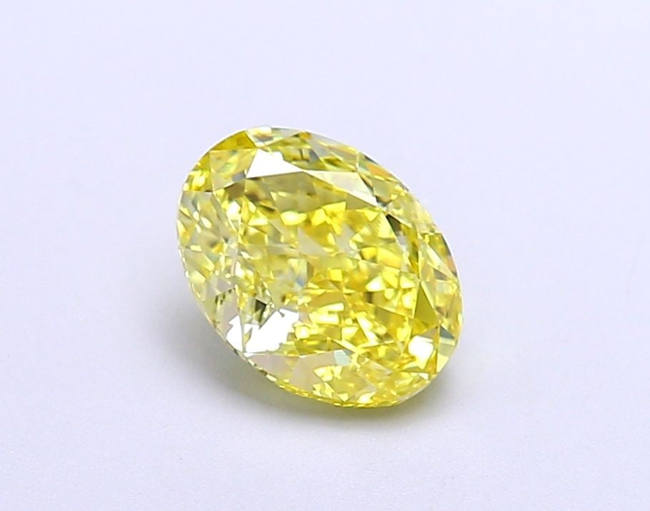 IGI Oval 1.32ct Fancy Vivid Yellow VVS2 Loose Lab Diamond: IGI Oval 1.32ct Fancy Vivid Yellow VVS2 Loose Lab Diamond Experience the vibrant beauty of nature in this stunning 1.32ct Fancy Vivid Yellow VVS2 lab-grown diamond, certified by the International Gemo