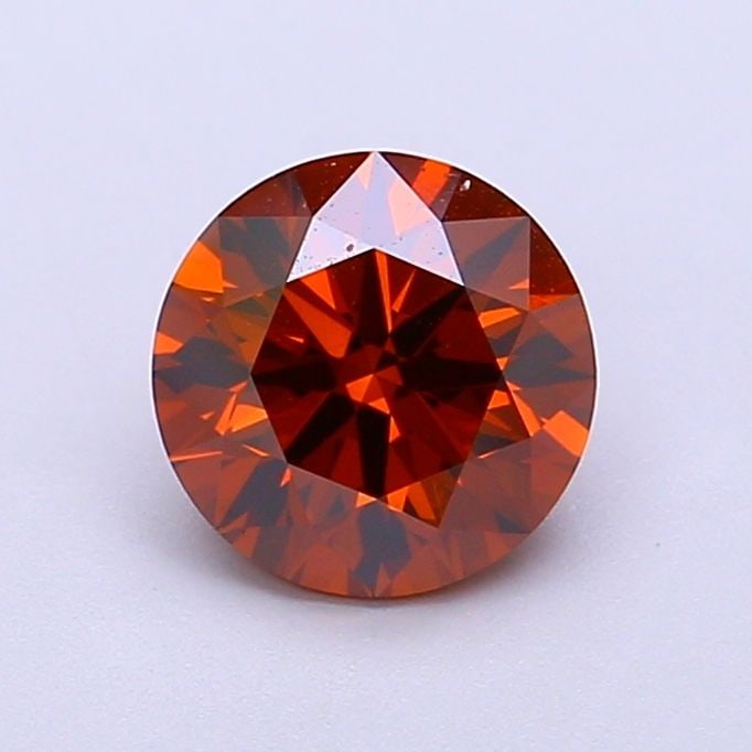 IGI Round 1.3ct Fancy Vivid Brownish Orange VVS2 Ideal Loose Lab Diamond: IGI Round 1.3ct Fancy Vivid Brownish Orange VVS2 Ideal Loose Lab Diamond Experience the beauty of a lab-grown diamond, certified by IGI as Fancy Vivid Brownish Orange in color, with exceptional clarit