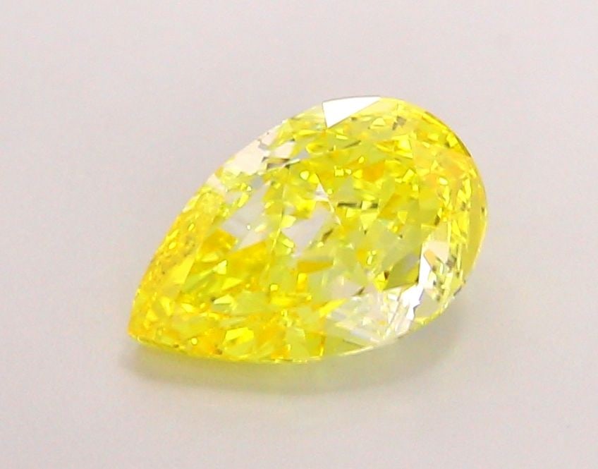 Loose Lab Diamond - IGI Pear 1.52ct Fancy Vivid Yellow VVS2: Loose Lab Diamond - IGI Pear 1.52ct Fancy Vivid Yellow VVS2 A rare and radiant gem, this 1.52ct Fancy Vivid Yellow Lab diamond boasts exceptional clarity (VVS2) and polish (EX), giving it a dazzling b