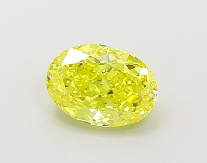 IGI Oval 1.02ct Fancy Vivid Yellow VVS2 Loose Lab Diamond: IGI Oval 1.02ct Fancy Vivid Yellow VVS2 Loose Lab Diamond A stunning Fancy Vivid Yellow diamond, certified by the International Gemological Institute (IGI), boasts exceptional clarity and polish, with