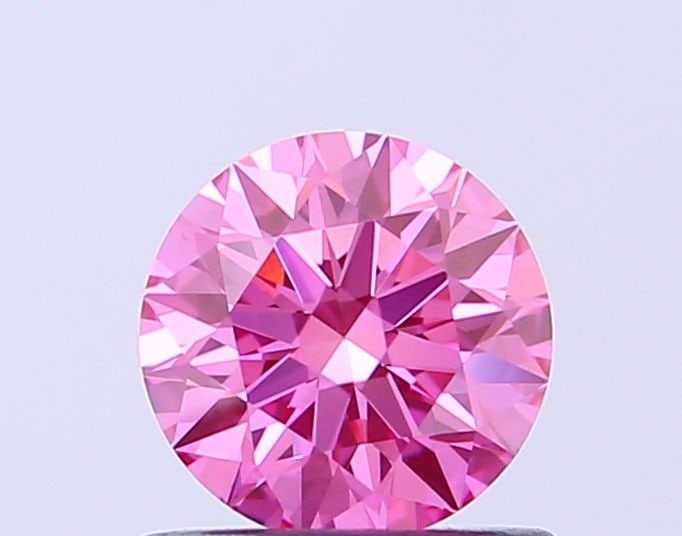 IGI Round 0.66ct Fancy Vivid Pink VVS2 Ideal Loose Lab Diamond: IGI Round 0.66ct Fancy Vivid Pink VVS2 Ideal Loose Lab Diamond Experience the rare beauty of a Fancy Vivid Pink diamond, one of the most coveted colors in nature. This exquisite 0.66ct lab-grown gem b