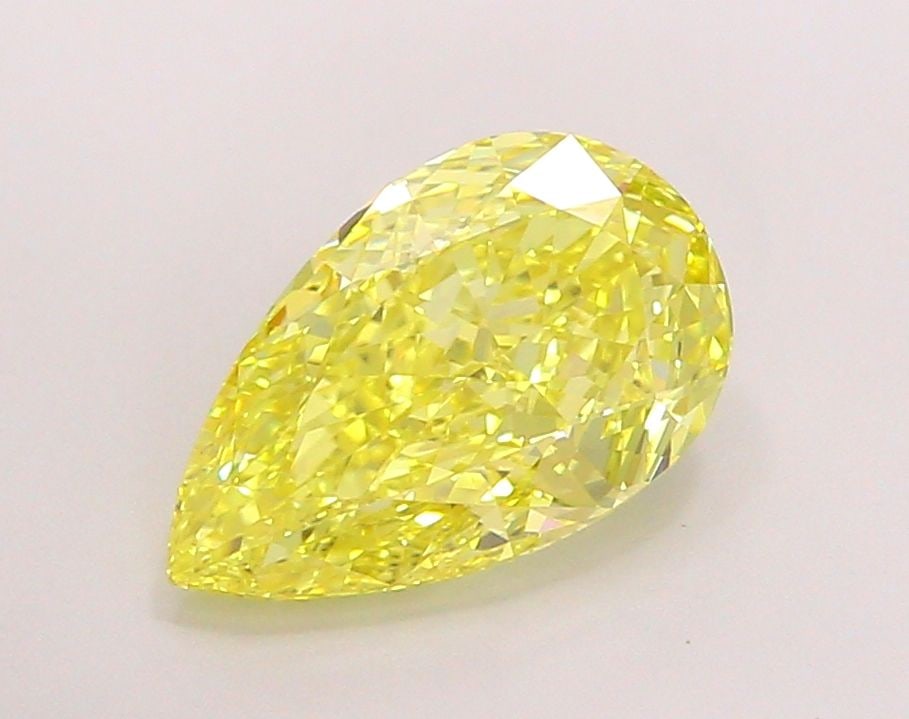 Loose Lab Diamond - IGI Pear 3.5ct Fancy Vivid Yellow VVS2: Loose Lab Diamond - IGI Pear 3.5ct Fancy Vivid Yellow VVS2 A stunning lab-grown diamond, certified by the International Gemological Institute (IGI), boasts an exceptional 3.5-carat Fancy Vivid Yellow