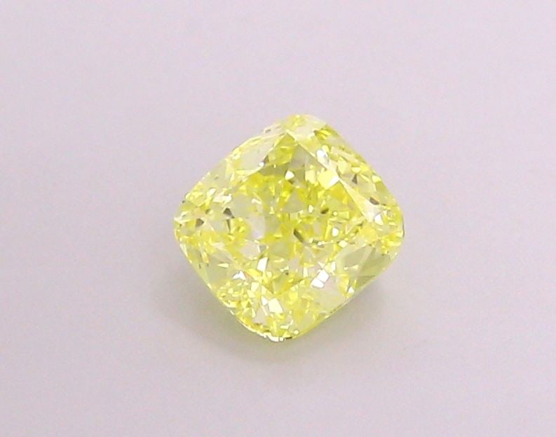 Loose Lab Diamond - IGI Cushion Modified 1.13ct Fancy Vivid Yellow VVS2: Loose Lab Diamond - IGI Cushion Modified 1.13ct Fancy Vivid Yellow VVS2 A stunning loose lab diamond, certified by the International Gemological Institute (IGI), boasts exceptional clarity and color w