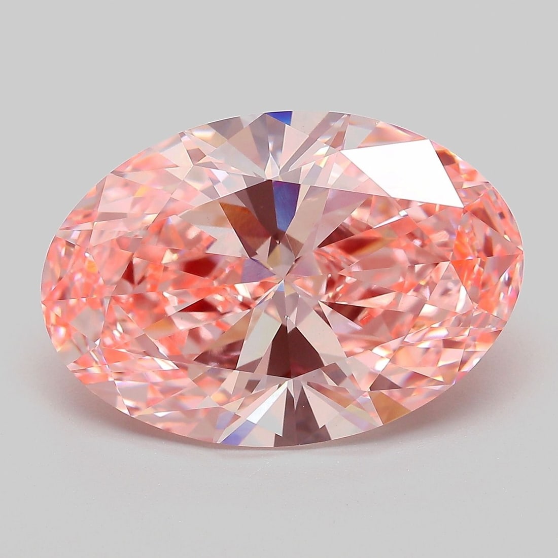 IGI Oval 10.08ct Fancy Vivid Pink VVS2 Loose Lab Diamond: IGI Oval 10.08ct Fancy Vivid Pink VVS2 Loose Lab Diamond A truly one-of-a-kind gem, this 10.08ct Fancy Vivid Pink VVS2 lab-grown diamond is a masterclass in color and clarity. Its EX polish and symmet